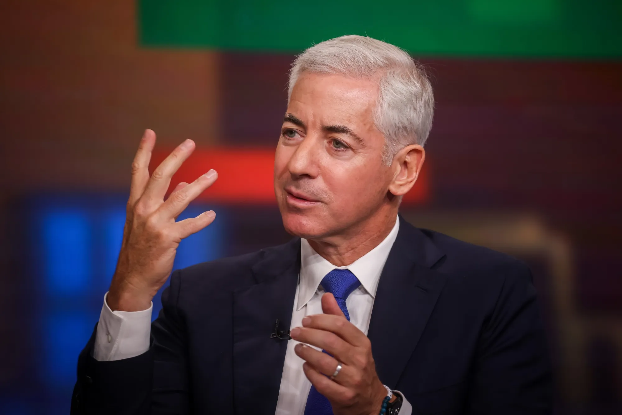 Bill Ackman gesturing while speaking during a television interview