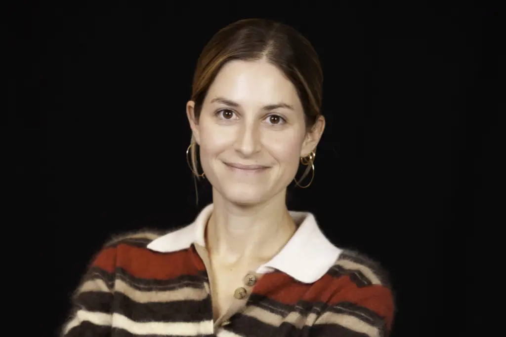 Claire Smilow smiling in a studio portrait