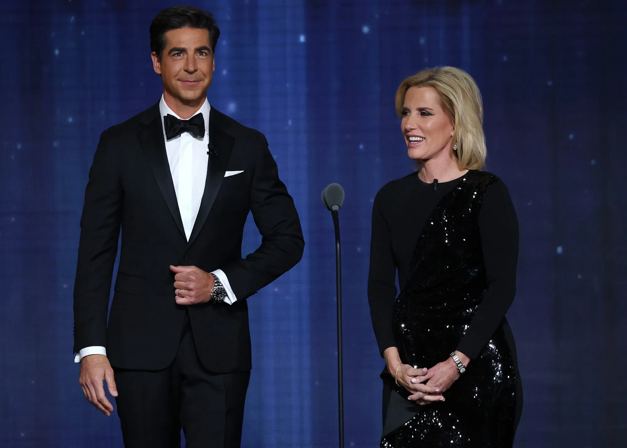 Fox News hosts Jesse Watters and Laura Ingraham on stage together