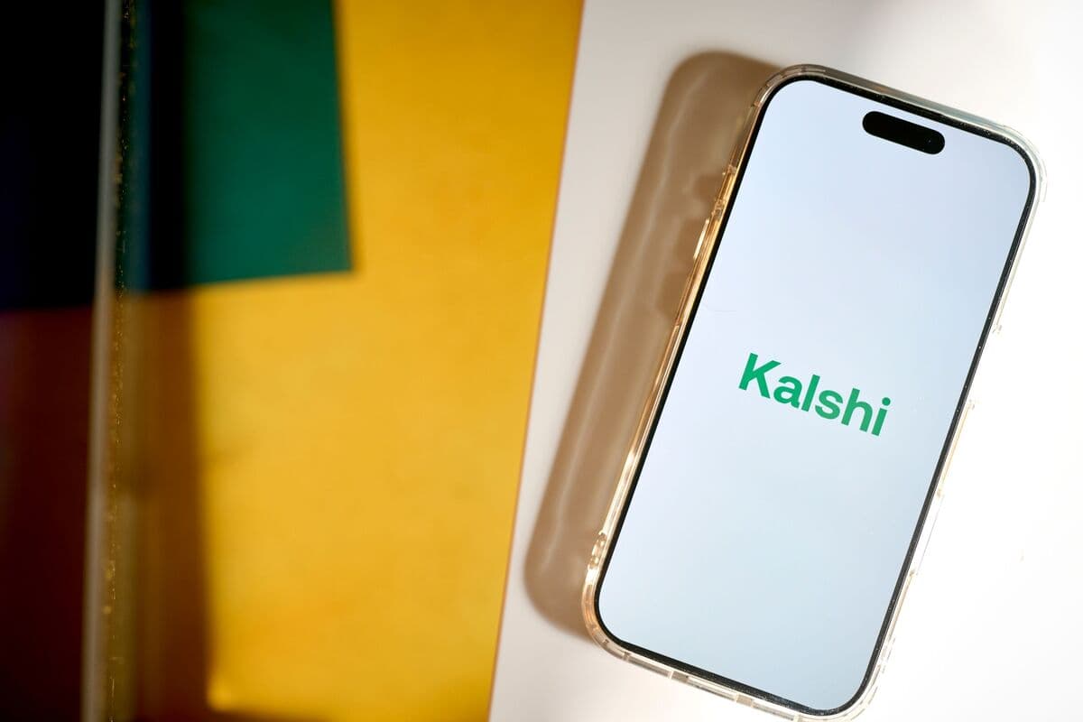 A smartphone displaying the Kalshi app logo
