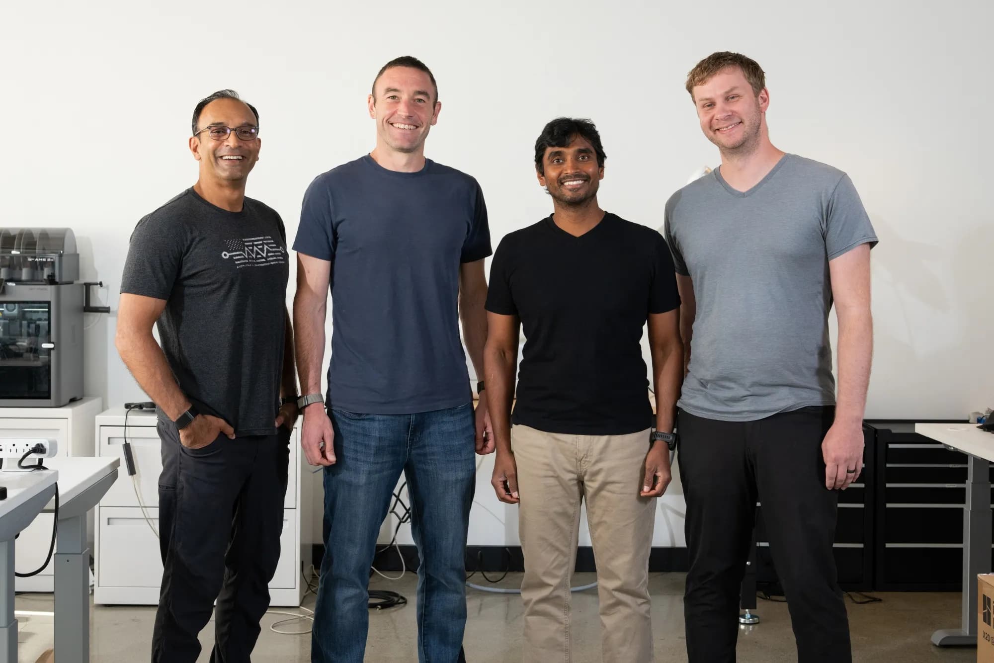 Warp Sciences co-founders Kevin Weil, Manohar Paluri, DJ Patil and Solomon Reisberg standing together in a lab