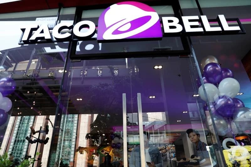 The Taco Bell sign above a storefront entrance