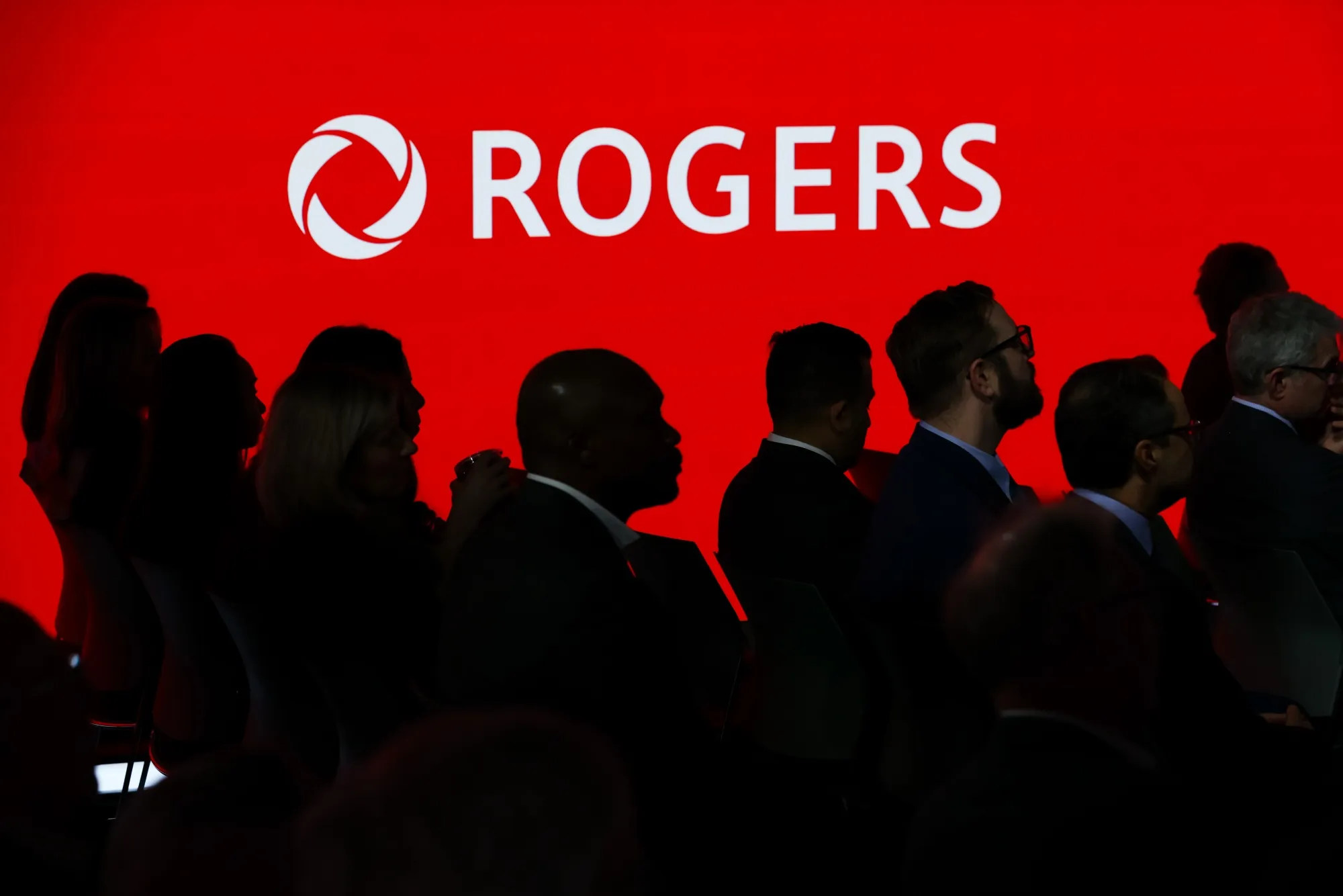 The Rogers Communications logo illuminated at a company event