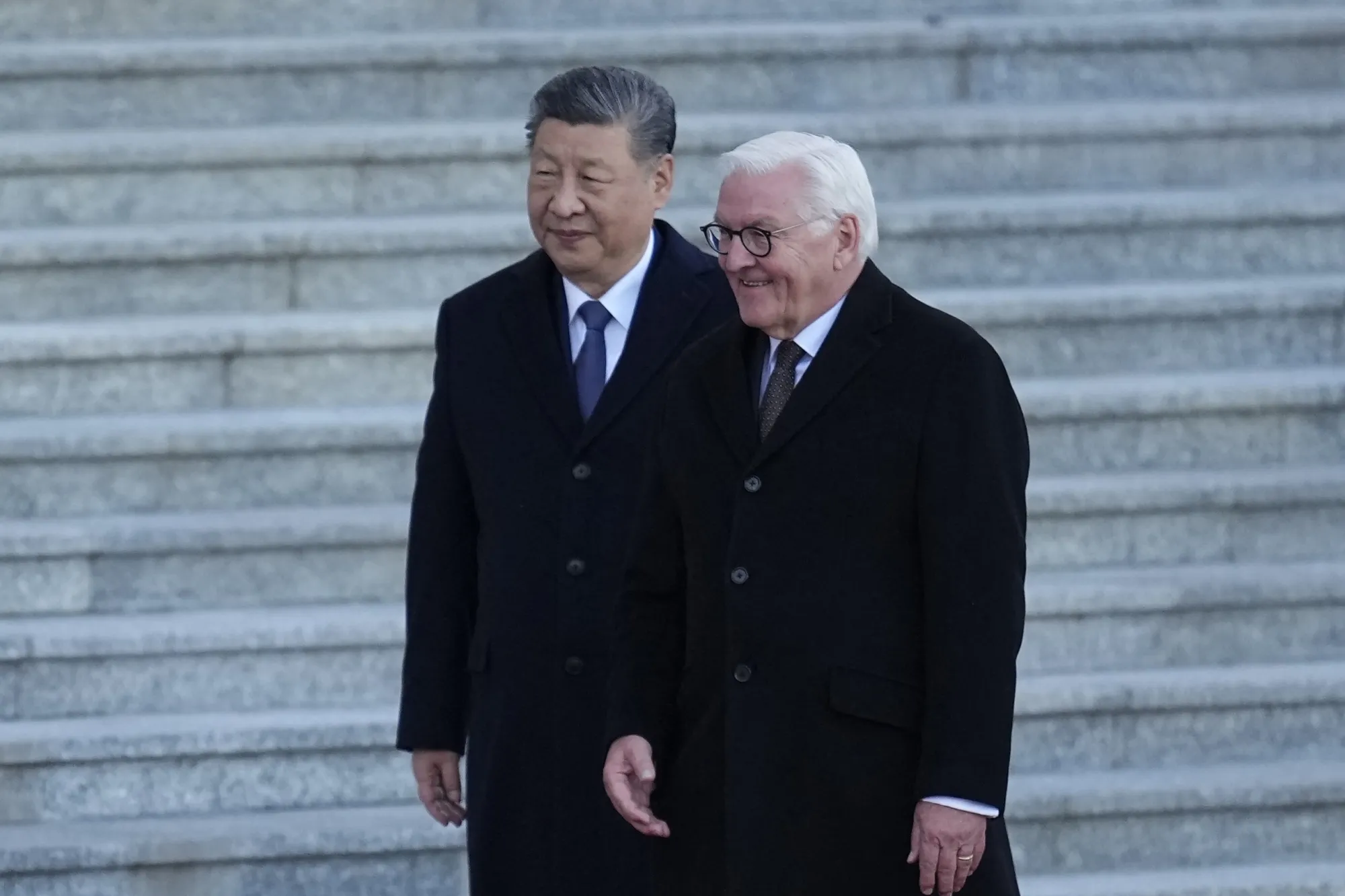 Chinese President Xi Jinping and German President Frank-Walter Steinmeier walking together